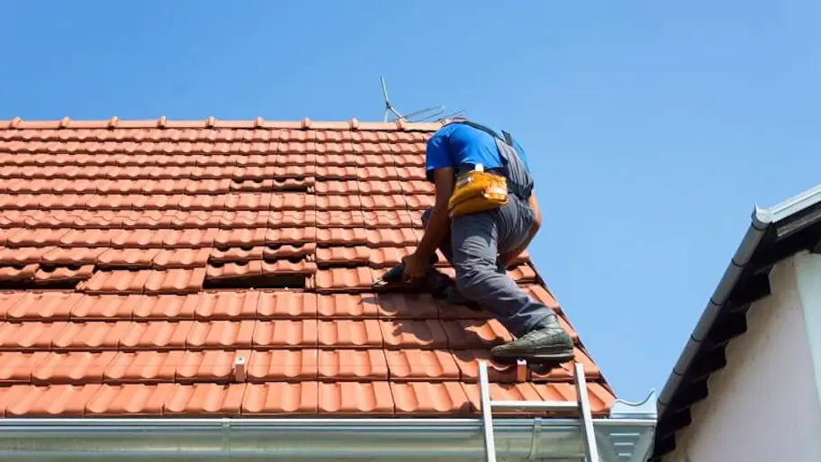 Image of a worker on a rooftop, performing maintenance or repairs, adjacent to a paragraph inviting viewers to book an appointment for roofing services.